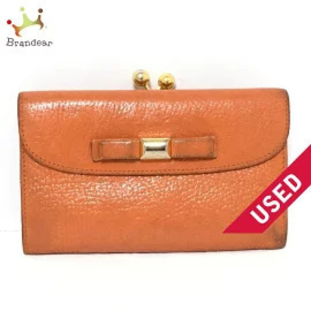 Miu Miu Tri fold Wallet Ribbon Clasp Closure Orange Leather